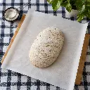 khlibne-tisto-na-bilomu-zhyrostiikomu-pergamenti.webp